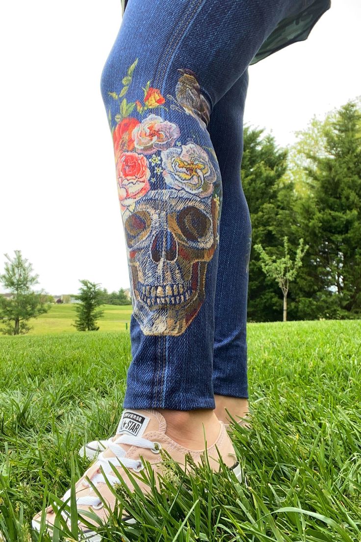 Don't sacrifice comfort for the look of denim. Wear the most realistic printed faux jean leggings ever made. These leggings are made of buttery-soft legging material.  The embroidered skull, rose and sparrow design is printed right on the leggings to appear realistic.  We know you'll love this amazing design as much as we do. You'll trick everyone around you to think you're actually wearing jeans!!        -- Our Fit Has You Covered -- * 88% polyester, 12% spandex * Luxuriously soft, ultra stretchy and irresistibly comfortable fabric * Long length: Scrunch up or fold under to your liking  * High-rise for a flattering, no muffin top fit * Can be worn before, during, and after pregnancy too! * A custom design by Stef Koza          -- Care -- * Wash cold, hang dry for lasting elasticity and co Skull Jeans, Embroidered Skull, Roses Blue, Buttery Soft Leggings, Denim Wear, Legging Fits, Skulls And Roses, Womens Leggings, After Pregnancy