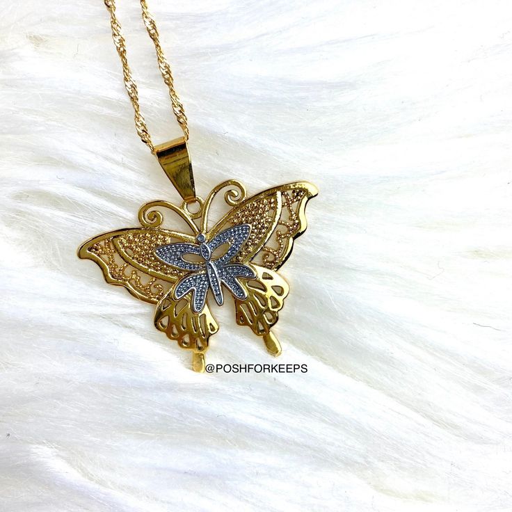 DESCRIPTION: Part of our exclusive "The Butterfly Effect Collection", the high polish 18K Gold Plated Butterfly Lace necklace features gold and silver butterfly lace design with beautifully crafted details. It is the perfect statement piece to compliment any outfit! LENGTH: Multiple chain sizes available for selection above. Pendant: 1.6 inch. MATERIAL: 18K Gold Plated over Stainless Steel. Hypoallergenic, Tarnish Free and Water Resistant. Mix and match with any of our 18K Gold Necklaces and Ank Luxury Gold Butterfly Charm Necklace, The Butterfly Effect, Butterfly Lace, 18k Gold Necklace, Lace Necklace, Butterfly Effect, Butterfly Jewelry, Gold Necklaces, Silver Butterfly