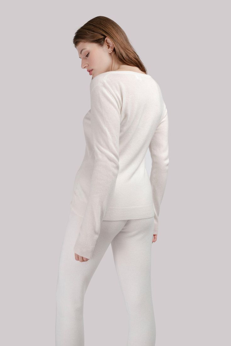 A lightweight V-neck cashmere sweater that's just enough to reveal and conceal at the same time. Longer sleeves are not only practical, they also look good. Be ultra-natural and choose an undyed version of natural beige or complement your wardrobe with a basic color range of white or gray.  Crafted from uncompromisingly premium Grade A cashmere with an ultra-fine 15-15. 5 micron fiber, this product offers unparalleled softness, exceptional warmth, and a luxurious second-skin feel. 100 % organic Knit Loungewear, Cashmere Sweater Women, Brand Magazine, Baby Shampoo, Stocking Fillers For Her, Color Range, Large Sweaters, Synthetic Materials, Independent Designers Fashion