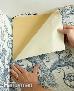 a person is cutting out an origami piece from the back of a couch