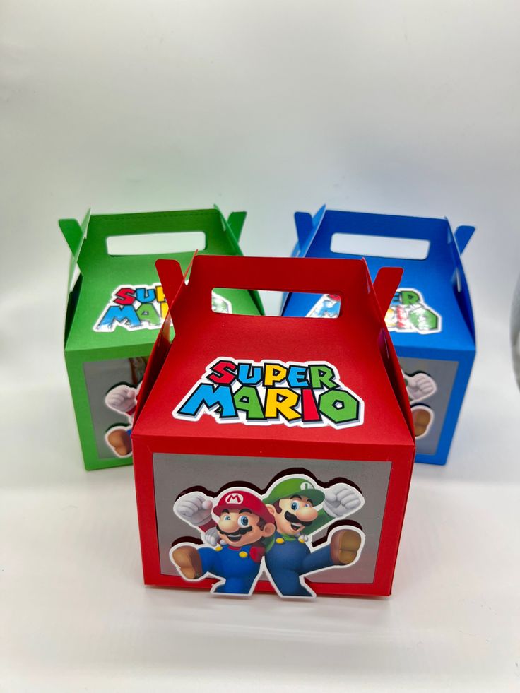 three boxes with mario bros stickers on them