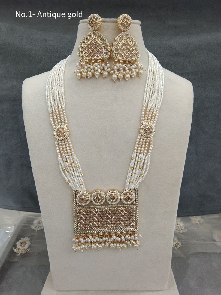 *Light Weight Gold Rani Haar Necklace Set. *No.1 to No.3 *Haar length: 10.5 inches (With drops) *Earrings length: 2.6 inches  (with drops)  *earrings Width: 1.4 inches *No.5-   *Haar length: 12 inches  *Earrings length: 2.1 inches  (with drops) ;   *earrings Width: 1 inches White Jewelry Sets For Wedding On Eid, White Hand Set Jewelry For Eid, Elegant White Pearl Necklace For Puja, White Beaded Necklaces For Festivals And Celebrations, White Kundan Necklace With Pearl Chain For Puja, Traditional Pearl White Necklaces For Celebrations, Traditional White Pearl Chain Necklace, Traditional Pearl White Necklace For Celebrations, Elegant Necklaces For Eid Puja