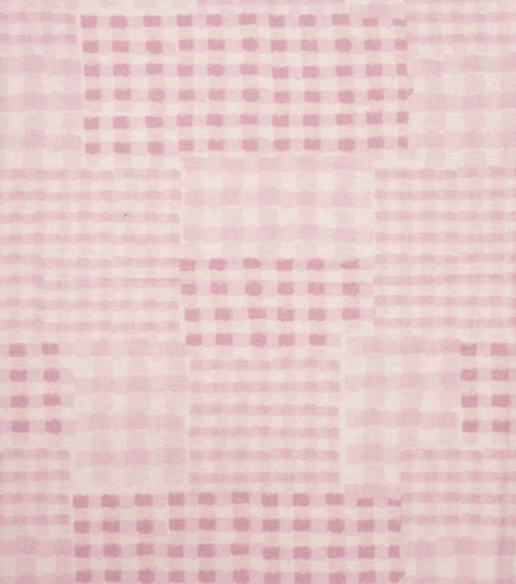 a pink rug with squares on it