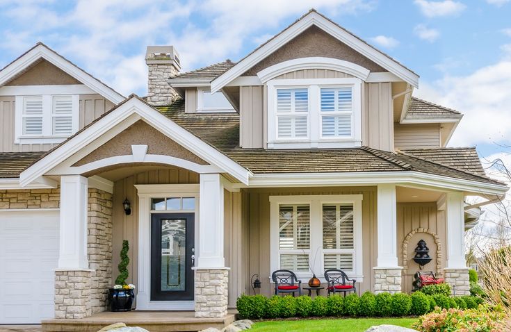 a house with white trim and windows on the front door is featured in this real estate ad