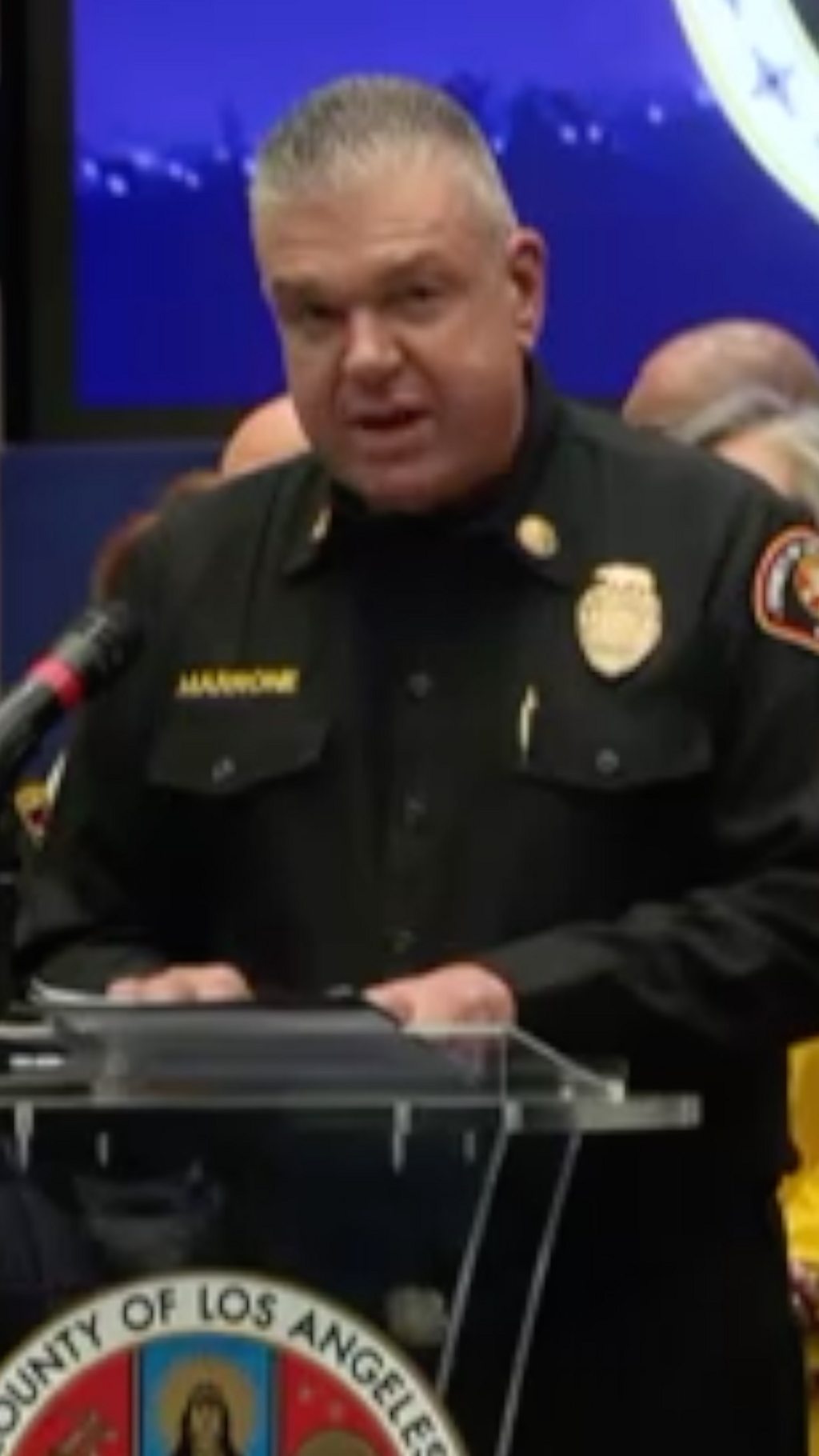 Fire chief Anthony Marrone in uniform talking into a mic