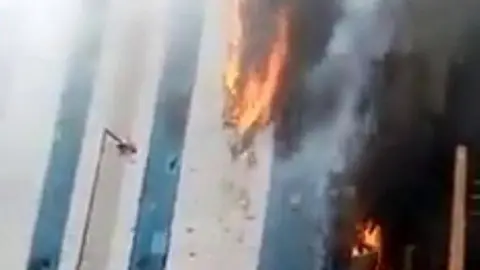 Video shows a fire raging at the building in the heart of the capital, Khartoum.