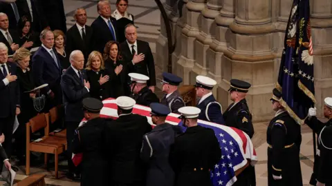 US Presidents react as the casket of Jimmy Carter is carried away