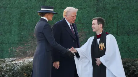 Melania and Donald Trump greet vicar