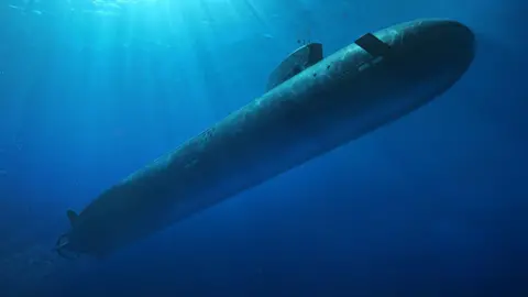 Artists impression of a large nuclear submarine, submerged and travelling through the ocean