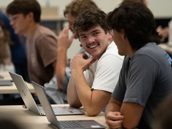 Students work together in a group on the first day of classes