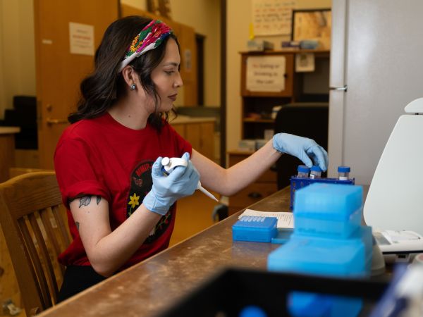 Haley Omeasoo works in a lab in the Social Science Building on the UM campus