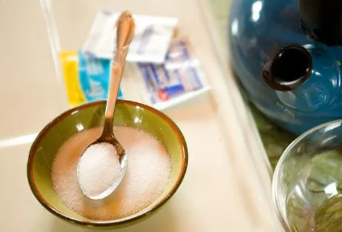 Photo of saline solution in a bowl with spoon.