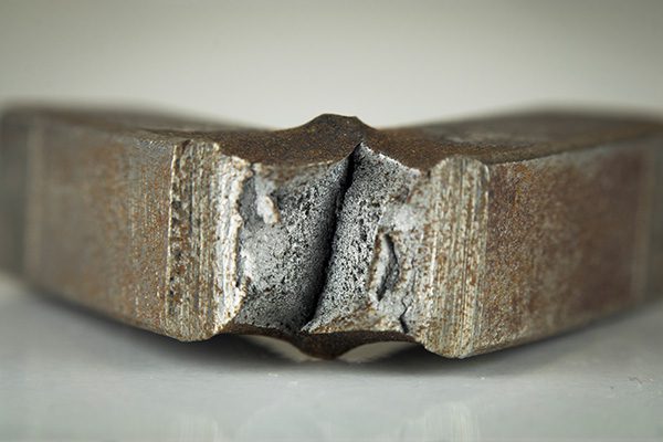 Low carbon steel sample that has been fracture tested