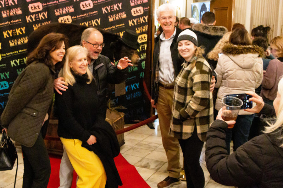 Moviegoers pose for photos with the Cocaine Bear taxidermy during the Cocaine Bear premiere on Friday, Feb. 24, 2023, at the Kentucky Theatre in Lexington, Kentucky. Photo by Brady Saylor | Staff