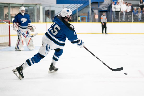 Kentucky defenseman Kyle Burke controls the puck during the Kentucky vs. Xavier club hockey game on Sunday, Nov. 5, 2023, at the Lexington Ice Center in Lexington, Kentucky. Kentucky won 11-1. Photo by Kolby Wohl | Staff