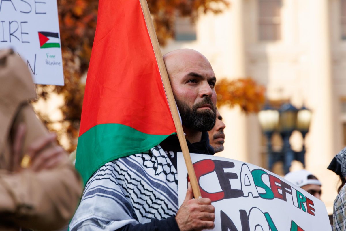 A man stands in protest for the lives killed in Gaza holding a sign that reads 'ceasefire now' on Nov. 7, 2023, in Frankfort, Kentucky. Photo by Matthew Mueller | Staff