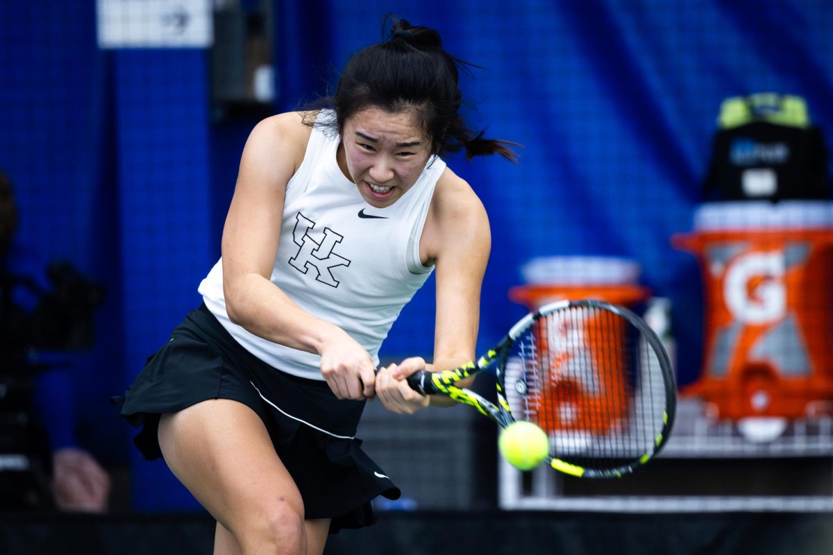 Kentucky freshman Julia Zhu hits the ball during the Kentucky vs Wichita State women's tennis match on Friday, Feb. 9, 2024, at the Hilary J. Boone Tennis Complex in Lexington, Kentucky. Kentucky won 5-2. Photo by Samuel Colmar | Staff