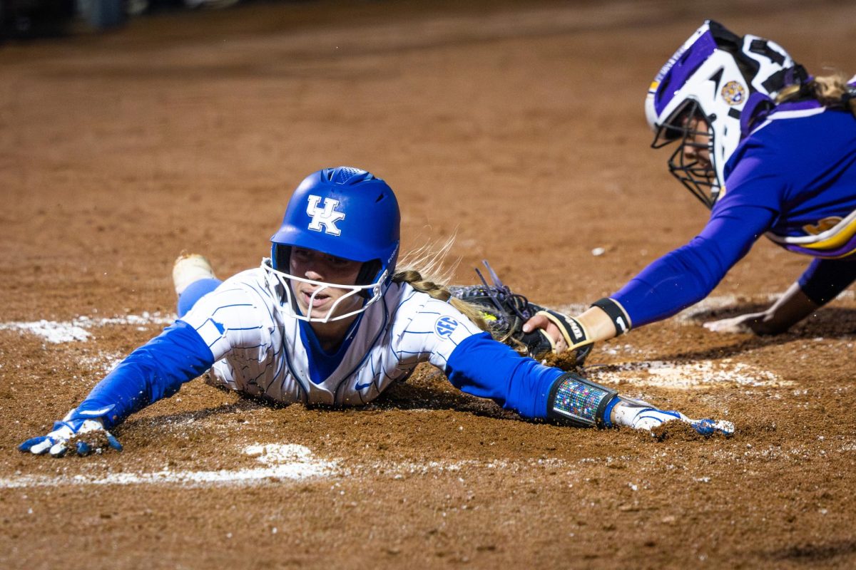 A Kentucky player slides into home during the No. 21 Kentucky vs. No. 3 LSU softball match on Friday, March 8, 2024, at John Cropp Stadium in Lexington, Kentucky. Kentucky lost 6-2. Photo by Samuel Colmar | Staff