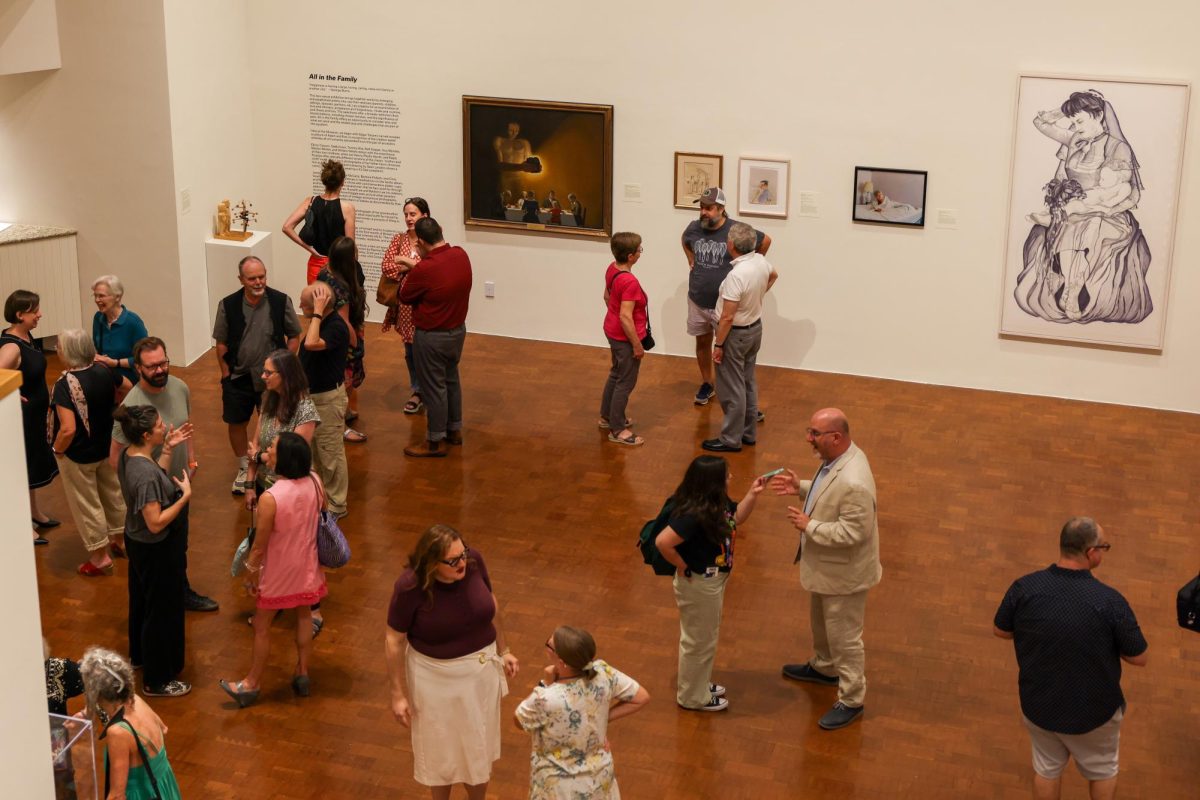 Members of the community attend the new Family Dynamics exhibit at the Singletary Center in Lexington, Kentucky, on Friday, Aug. 30, 2024. Photo by Sydney Yonker | Staff