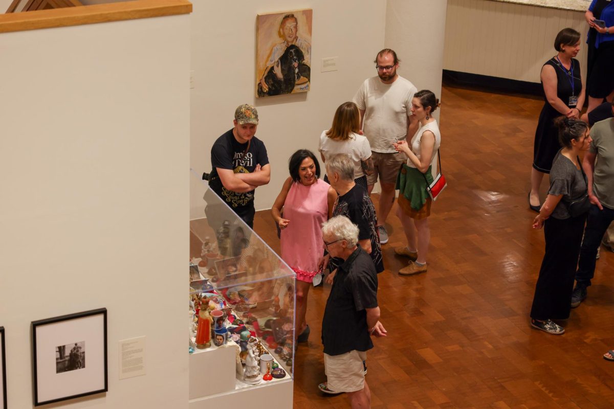 Members of the community attend the new Family Dynamics exhibit at the Singletary Center in Lexington, Kentucky, on Friday, Aug. 30, 2024. Photo by Sydney Yonker | Staff