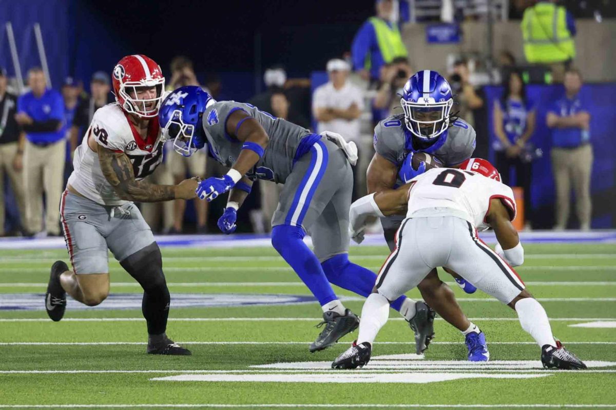 Kentucky Wildcats running back Demie Sumo-Karngbaye (0) fights through a tackle during the game between Kentucky and Georgia on Saturday, Sept. 14, 2024, at Kroger Field in Lexington, Kentucky. Kentucky lost to Georgia 13-12. Photo by Sydney Yonker | Staff