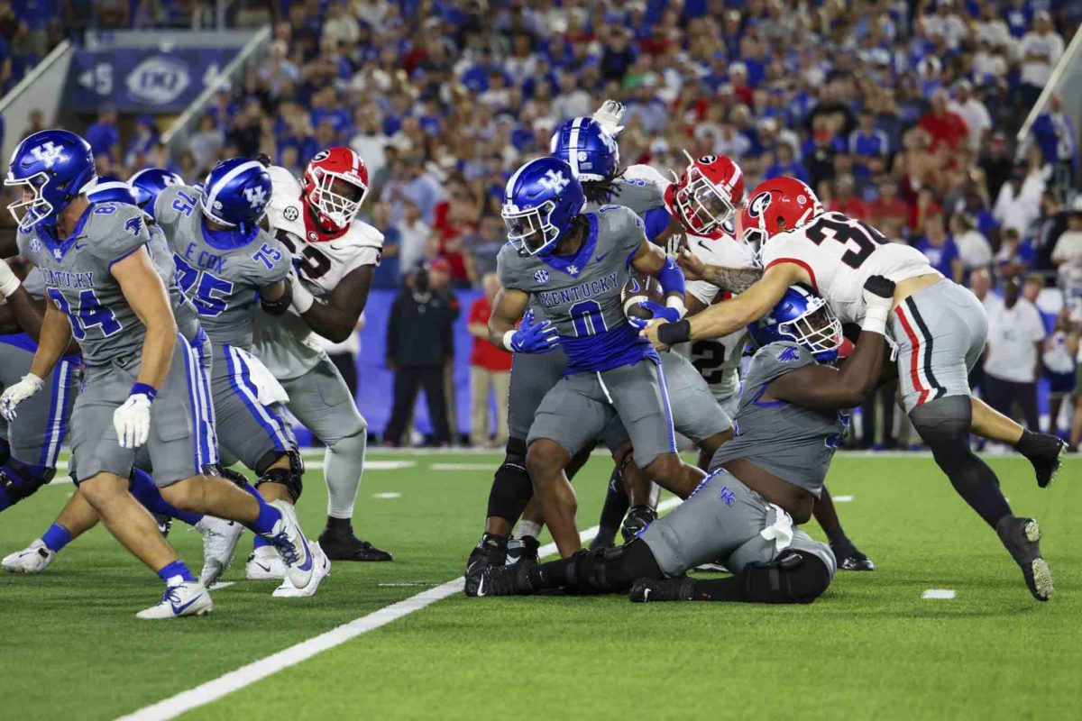 Kentucky Wildcats running back Demie Sumo-Karngbaye (0) fights through Georgia Bulldogs defense during the game between Kentucky and Georgia on Saturday, Sept. 14, 2024, at Kroger Field in Lexington, Kentucky. Kentucky lost to Georgia 13-12. Photo by Sydney Yonker | Staff