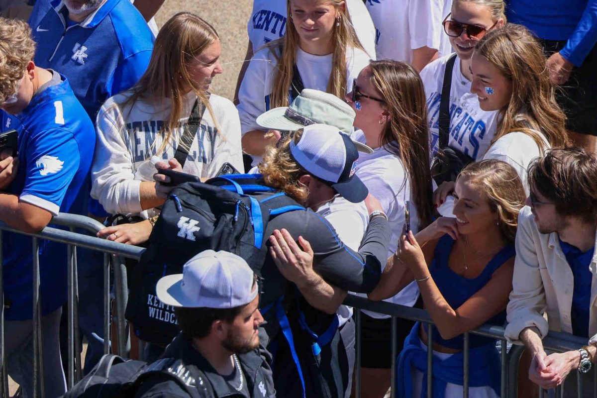 Kentucky quarterback Brock Vandargriff hugs a fan during the cat walk on Saturday, Sept. 7, 2024, at Kroger Field in Lexington, Kentucky. Photo by Sydney Yonker | Staff