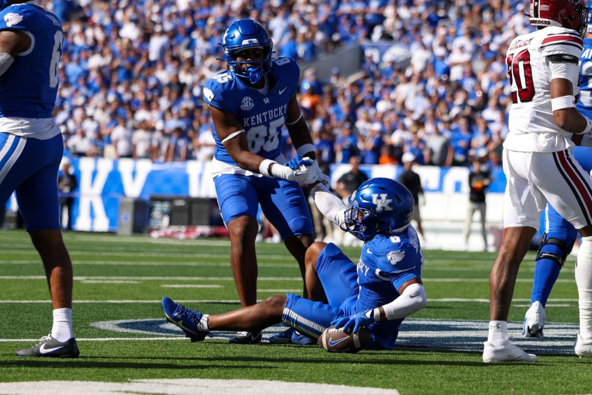 Kentucky tight end Jordan Dingle helps up running back Demi Sumo-Karngbaye during the Kentucky vs Southern Carolina football game on Saturday, Sept. 7, 2024, at Kroger Field in Lexington Kentucky. Kentucky lost 31-6. Photo by Sydney Yonker | Staff