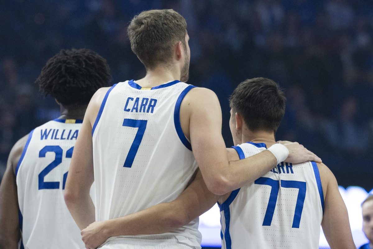 Kentucky Wildcats forward Andrew Carr (7) and Kentucky Wildcats guard Kerr Kriisa (77) hug after a timeout was called during the basketball game vs. Lipscomb Tuesday, Nov. 19, 2024, at Rupp Arena in Lexington, Kentucky. Photo by Matthew Mueller | Photo Editor