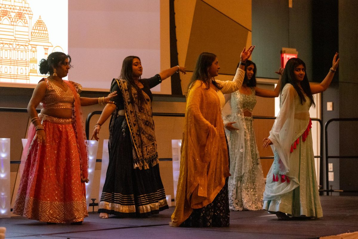 The Kentucky Indian Student Association executive board dances during Diwali on Saturday, Nov. 9, 2024, at Gatton Grand Ballroom in Lexington, Kentucky. Photo by Sydney Yonker | Staff