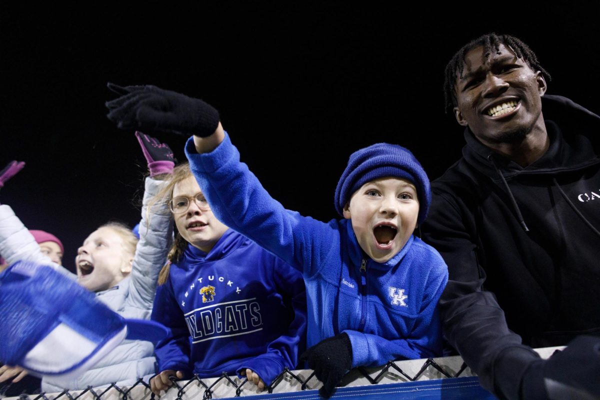 Fans cheer as the Kentucky goalkeeper saves a penalty in extra time of the Kentucky vs. WVU soccer match on Friday, Nov. 15, 2024, at the Wendell and Vickie Bell Soccer Complex in Lexington, Kentucky. Kentucky won 4-2 in penalties in the first round of the NCAA Women’s Soccer Championship. Photo by Christian Kantosky | Staff