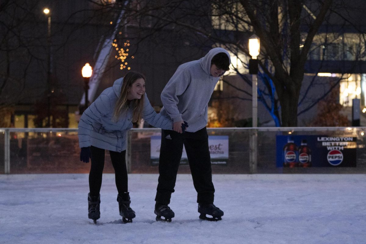 Members of Allansville Baptist Church skate around the rink on Saturday, Nov. 23, 2024, at the Triangle Park Ice Rink in Lexington, Kentucky. Photo by Christian Kantosky | Assistant Photo Editor