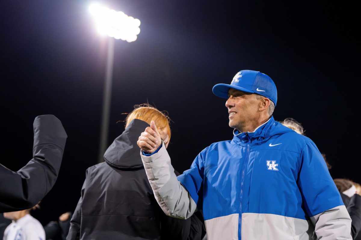 Kentucky Wildcats head coach Troy Fabiano smiles as he celebrates with his team after the win in the Kentucky vs. WVU soccer match on Friday, Nov. 15, 2024, at the Wendell and Vickie Bell Soccer Complex, in Lexington, Kentucky. Kentucky won 4-2 in penalties in the first round of the NCAA Women’s Soccer Championship. Photo by Will Luckett | Staff