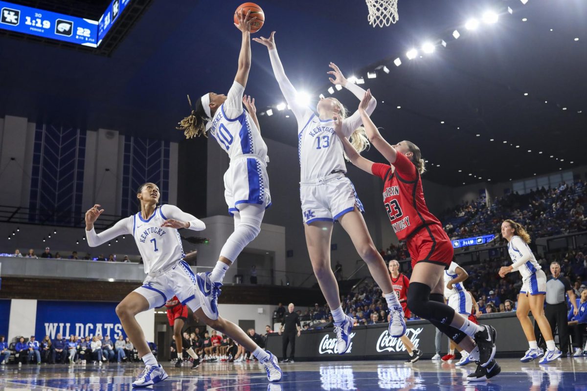 Kentucky Wildcats guard Dazia Lawrence (10) and Kentucky Wildcats center Clara Strack (13) jump for a rebound during the basketball game vs. WKU on Saturday, Dec. 28, 2024, at Historic Memorial Coliseum in Lexington, Kentucky won 88-70 Photo by Matthew Mueller | Photo Editor