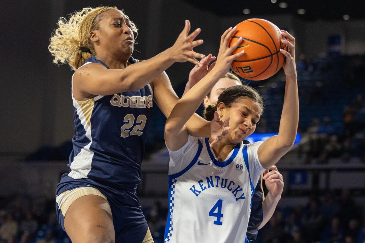 Kentucky Wildcats guard Lexi Blue (4) fights for a rebound during the Kentucky vs Queens women’s basketball on Monday, Dec. 9, 2024, at Historic Memorial Coliseum in Lexington, Kentucky. Kentucky won 87-45. Photo by Sydney Yonker | Staff