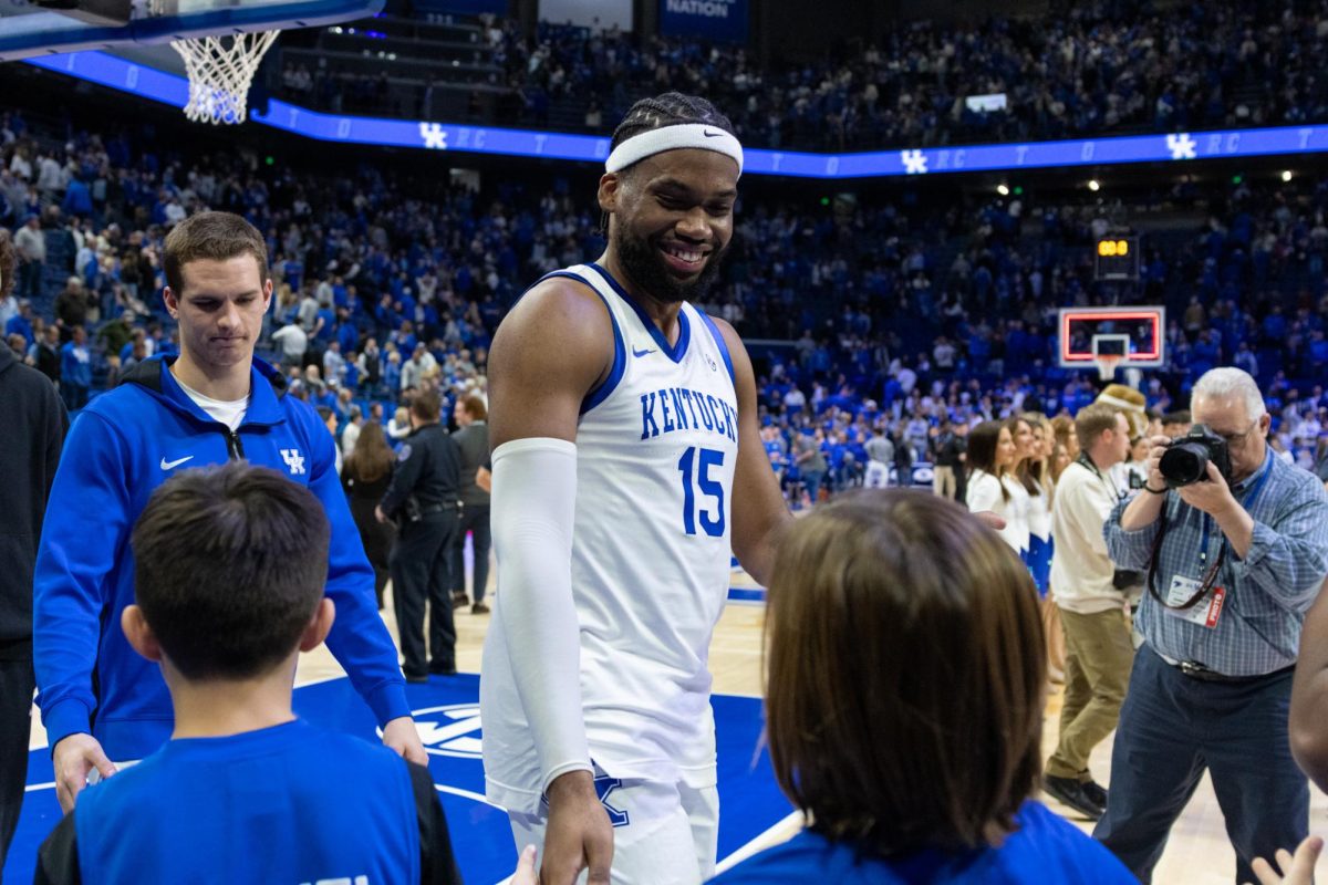 Kentucky Wildcats forward Ansley Almonor (15) high-fives fans after the Kentucky vs. Brown men’s basketball game on Tuesday, Dec. 31, 2024, at Rupp Arena in Lexington, Kentucky. Kentucky won 88-54. Photo by Sydney Yonker | Staff