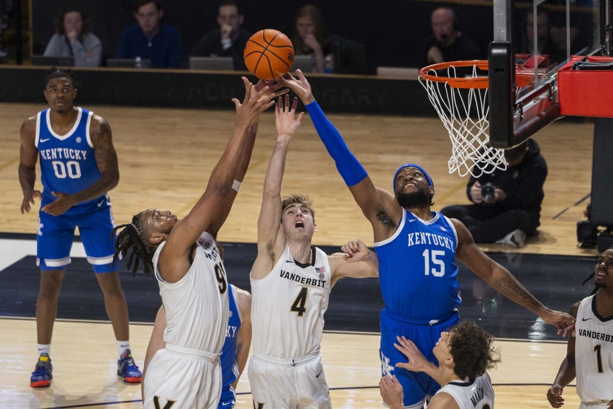 Kentucky Wildcats forward Ansley Almonor (15), Vanderbilt Commodores guard Grant Huffman (4), and Vanderbilt Commodores forward Devin McGlockton (99) try and secure a rebound during the first half of the basketball game vs. Vanderbilt on Saturday, Jan. 25, 2025, at Memorial Gymnasium in Nashville, Tennessee. Photo by Matthew Mueller | Photo Editor