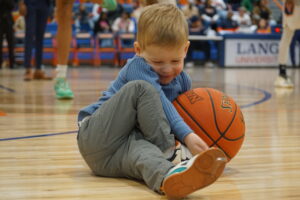 Reece Wright holding a basketball.