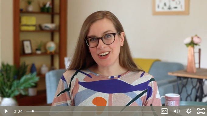 Woman speaking to camera with video player buttons underneath