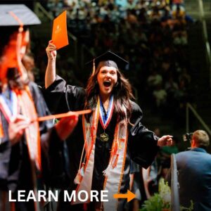 Student crossing stage at graduation