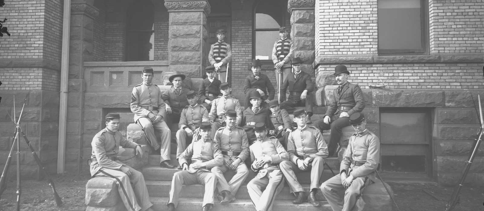 Cadets Leaning on Old Main - Fall