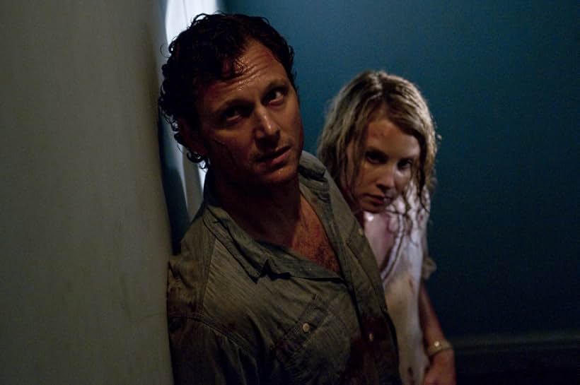 Tony Goldwyn and Monica Potter in The Last House on the Left (2009)