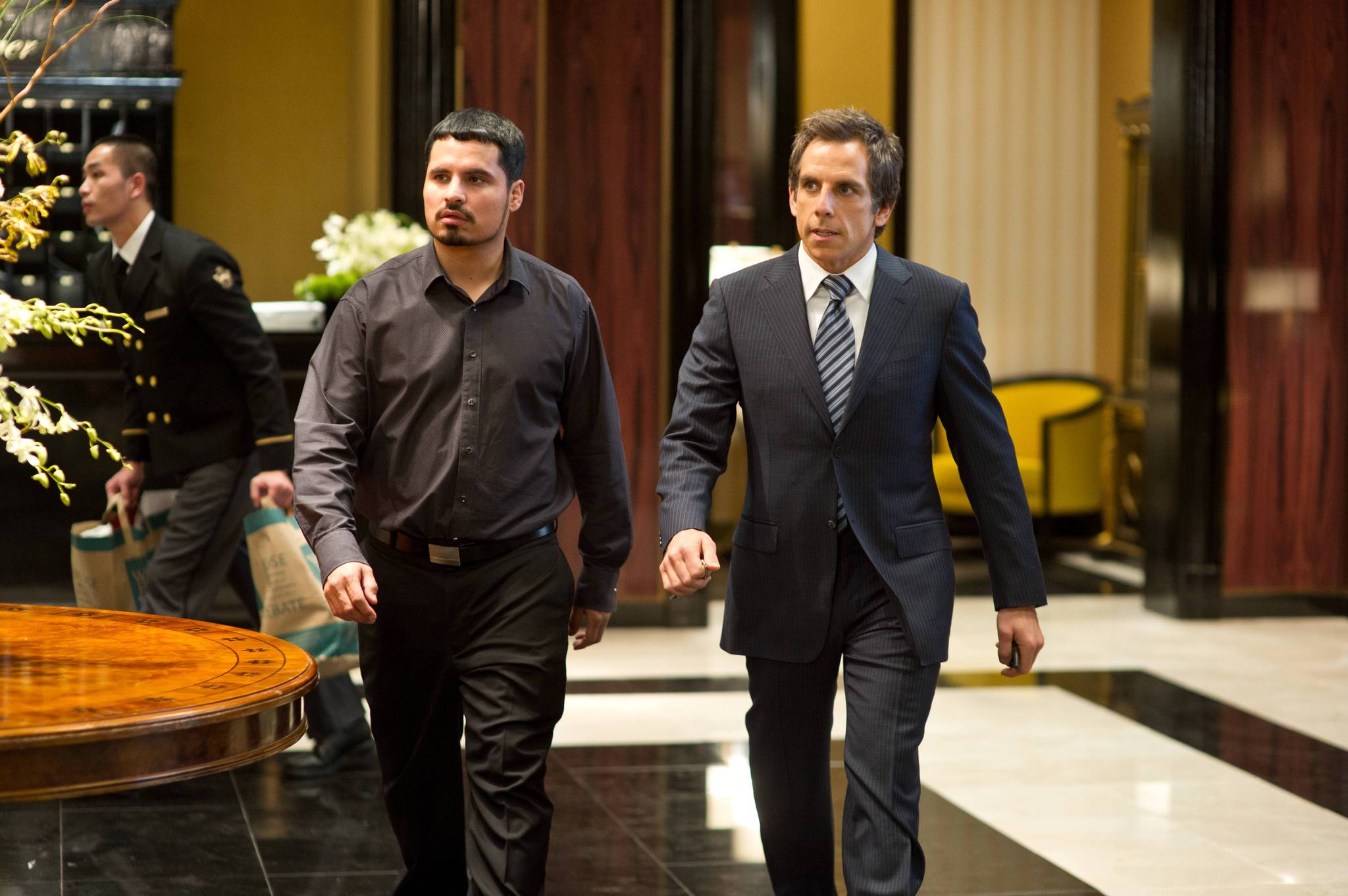 Ben Stiller and Michael Peña in Tower Heist (2011)