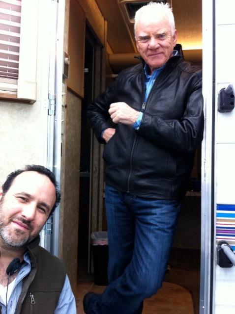 Jason Ensler and Malcolm McDowell on the set of Franklin & Bash