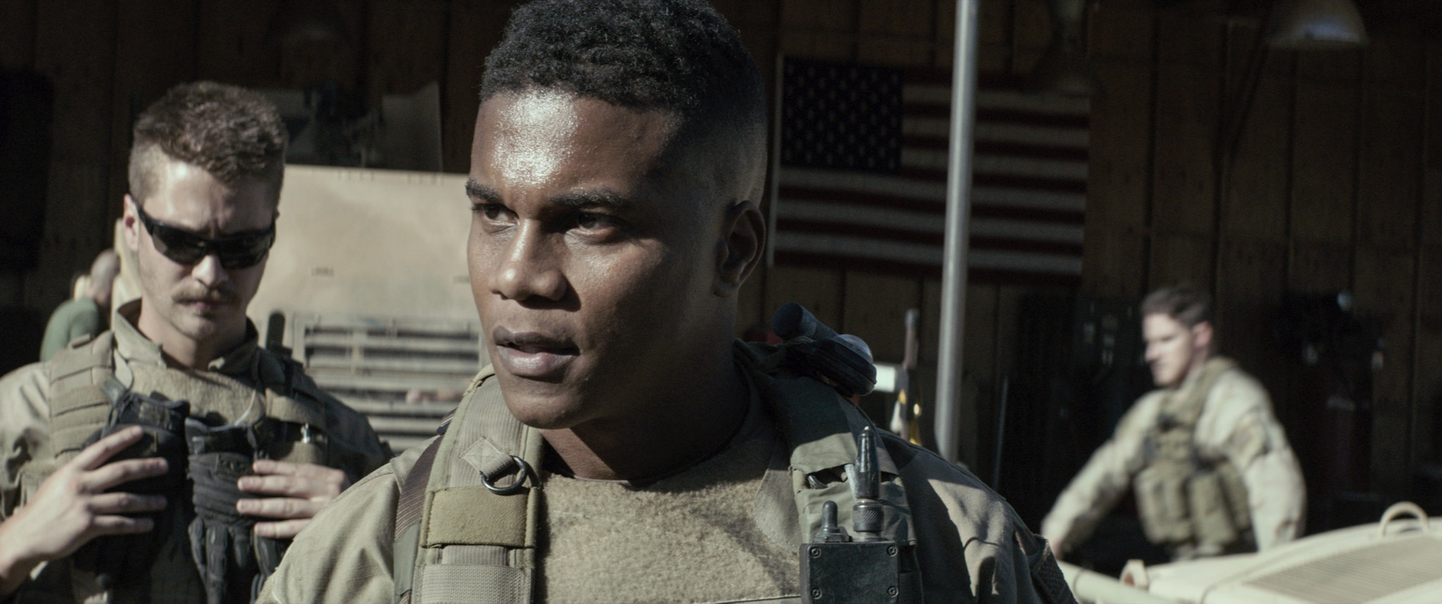 Cory Hardrict and Luke Grimes in American Sniper (2014)