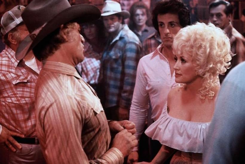 Sylvester Stallone, Dolly Parton, and Tim Thomerson in Rhinestone (1984)