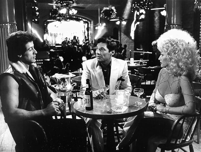 Sylvester Stallone, Dolly Parton, and Ron Leibman in Rhinestone (1984)