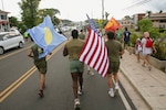 U.S. Marines with Combat Logistics Battalion 13, Combat Logistics Regiment 17, 1st Marine Logistics Group, participate in a 5K run and walk in support of anti-human trafficking awareness on World Day Against Trafficking in Persons during exercise Koa Moana 24 at Koror, Palau, July 30, 2024. During Koa Moana’s deployment throughout the Indo-Pacific region, U.S. Marines and Sailors from I Marine Expeditionary Force work to strengthen alliances and partnerships with development of interoperable capabilities, combined operations, theater security cooperation, and capacity-building efforts. (U.S. Marine Corps photo by Sgt. Nello Miele)