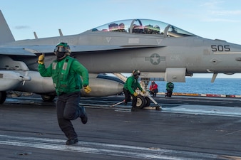 Sailors conduct flight operations aboard USS Carl Vinson (CVN 70) in the Philippine Sea.