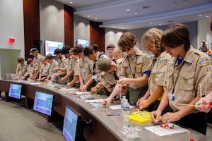 Scouts from across Central Florida and as far as Kentucky participated in the Air Force Technical Applications Center’s Nuclear Science Merit Badge program, an annual event the nuclear treaty monitoring center hosts to assist scouts with earning the coveted badge. Here, the scouts learn how to construct a 3-D model of an element and its isotopes using colorful jellied candies and toothpicks. (U.S. Air Force photo by Susan A. Romano)